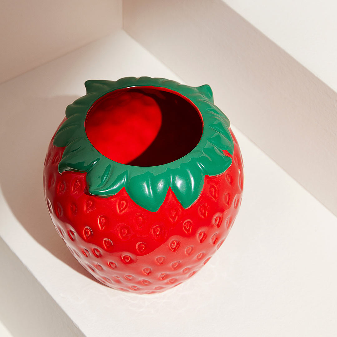 red strawberry plant pot